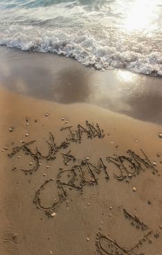 there is a message written in the sand on the beach