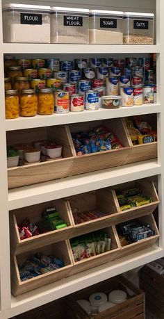 an organized pantry filled with lots of food and drinks in bins next to each other