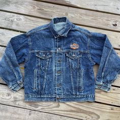 Vintage Levi's Stone Wash Blue Jean jacket Red Tab Harley Davidson patches on chest and back Made in USA  Double chest pockets Size tag removed, 46 inch chest  See measurements below and compare to yours for sizing accuracy  Check out all photos for overall condition  Freshly washed and dried (still has a vintage smell to it but should be gone after a couple of more washes) Smoke free home Fast handling time for faster shipping Measurements taken laid flat and in inches Pit to pit: 23 inches (46 inches around) Overall length from top of shoulder to hem: 23.5 inches Sleeve Length: 22 inches Shoulder seam to shoulder seam: 21 inches Harley Davidson Patches, Blue Jean Jacket, Denim Coat, Blue Jean, Red Jacket, Levi Strauss, Vintage Levis, Vintage Denim, Size Tag