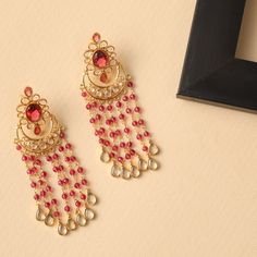 Description These classic chandbali earrings from Tarinika are a timeless piece with a simple yet striking style. It features polki stones arranged in a floral pattern with a chandbali drop and bead chain on a gold-plated base. The minimal design and the beaded chains enhance its elegance and luxury. Details & Specifications: Materials used: Brass Alloy with Antique Plating Weight - Earrings 21.80 gm Length - Earrings 8 cm Make it custom Want to make it a custom earring? Sure! Reach out to us at Light Weight Jewellery Designs, Chand Bali, Luxury Details, Indian Accessories, Punjabi Fashion, Buy Jewellery Online, Chandbali Earrings, Indian Jewellery Design, Traditional Earrings