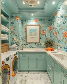 a washer and dryer in a room with floral wallpaper on the walls