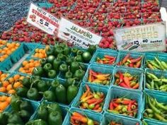 fresh fruits and vegetables are on display for sale