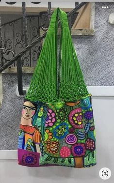 a colorful bag hanging from the side of a stair case