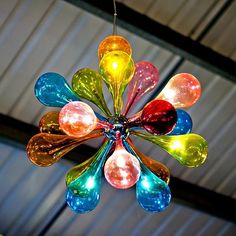 a multi colored chandelier hanging from a ceiling