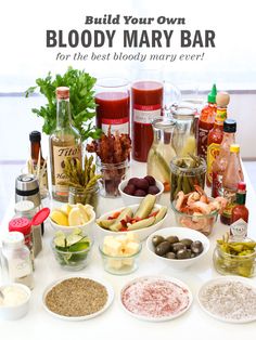 a table topped with bowls filled with different types of food and condiments on top of it