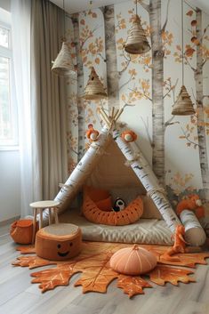 a teepee tent in the middle of a room with trees and leaves on it