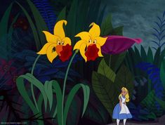 alice and the yellow flowers are looking at each other in front of some green plants