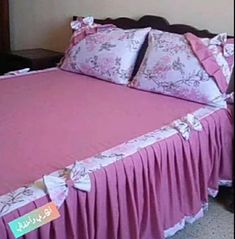 a bed with pink bedspread and matching pillowcases in a bedroom setting