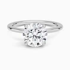 a round brilliant cut diamond engagement ring in 18k white gold on a plain band