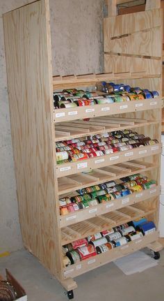 a wooden shelf filled with lots of food cans