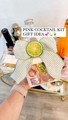 the pink cocktail kit is being held up