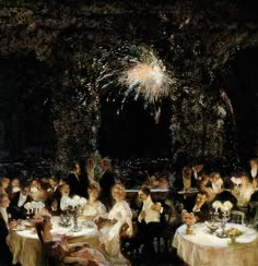 a group of people sitting at tables with fireworks in the background