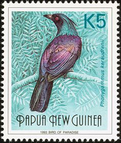 a stamp with a bird sitting on a tree branch