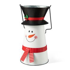 a white snowman with a black hat and red scarf on it's head