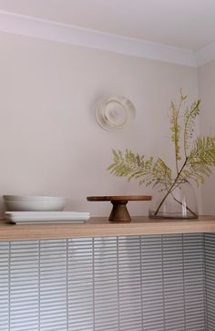 Timber shelf in the minimalist kitchen makeover by The Glade Design Finger Tiles Kitchen Splashback, White Finger Tiles Kitchen, Kitchen Kitkat Tile, Modern 70s Kitchen, White Kitkat Tiles Kitchen, Japanese Kitchen Tiles, White Kitkat Tiles, 70s Kitchen Makeover, Kitchen Japanese Style