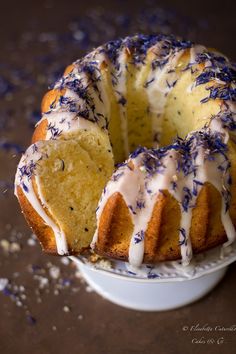 a bundt cake with white frosting and sprinkles