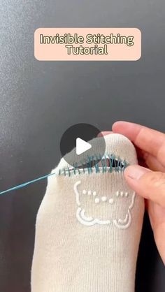 someone is stitching the stitches on their socks