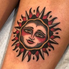 a sun tattoo on the thigh with a woman's face