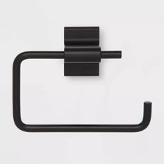 a black toilet paper holder on a white wall with the handle extended to it's left side