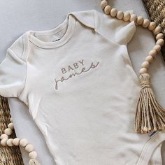 Embroidered Onesies® Brand Personalized Baby Girl Onesies® - Etsy Onsie Embroidery Ideas, Cotton Onesie For Baptism, Cotton Baptism Onesie With Short Sleeves, Spring Baptism Cotton Onesie, Cream Short Sleeve Cotton Onesie, Cream Cotton Short Sleeve Onesie, Cute Cotton Onesie For Baptism, Embroidered Baby Onesie, Baby Onesie Embroidery