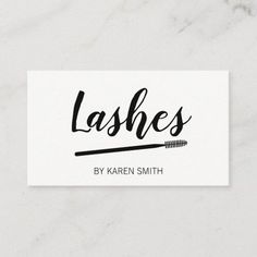 lashes business card with the word lashes written in cursive writing on it and an arrow