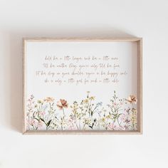 a wooden frame with flowers on it that says, hold the little things in your heart