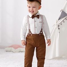 Questions? Leave A Comment Below! Neutral Fall Family Photo Outfits, Girls Nike Outfits, Waiter Outfit, Toddler Smock, Thanksgiving Baby Outfits, Brown Suspenders, Toddler Suits, Wedding Archway