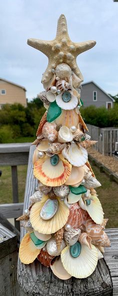 a christmas tree made out of seashells and shells