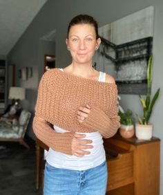 a woman standing with her arms crossed