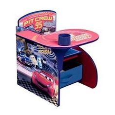 a toy desk with cars on it and a magazine rack in the shape of a car