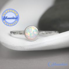 "This delicate Sterling Silver Opal Promise Ring features a 6 mm cabochon that has been carefully set in a highly polished fine silver bezel. The band is made of a sturdy round Sterling Silver wire that has been given a hammer texture, then carefully polished for a bright finish. Our setting process involves carefully tightening the fine silver bezel down around the stone, then beveling at the edge of the bezel to further compress the silver, creating a water-tight seal with no stone movement. T Simple Opal Ring, Opal Ring Simple, Opal Promise Ring, Promise Rings Simple, Opal Stacking Ring, Sterling Silver Opal Ring, Rose Gold Opal Ring, Unique Promise Rings, Silver Opal Ring