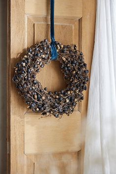 a door with a wreath hanging on it