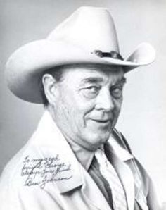 an old photo of a man wearing a cowboy hat