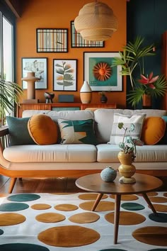 a living room filled with lots of furniture and pictures on the wall above it's coffee table