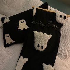 two black and white towels with ghost faces on them