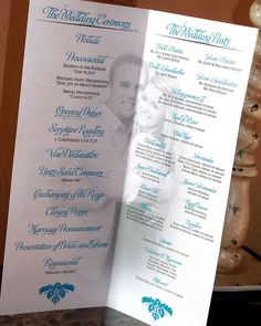 a blue and white wedding program on a table