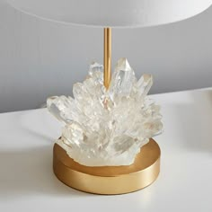 This gem of a lamp has shine that works overtime, thanks to the clear, cast-resin crystal that looks just like the real thing. The gold base and crisp linen shade give it extra polish.DETAILS YOU'LL APPRECIATE Expertly crafted with a sturdy iron base and resin crystals with a linen shade. Lamp base is finished in gold. On/off switch located on the cord. KEY PRODUCT POINTS Available in a set of 2. Two prong plug-in. Bulb (1): 60 watt type A bulb (not included). Conforms to UL standards - Dry Rate Velaris Bedroom, Room Decor Crystals, Geode Lamp, Lamp Pottery, Barn Bedrooms, Geode Decor, Crystal Room, Healing Light, Crystal Healer