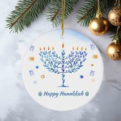 a hanukkah ornament hanging from a christmas tree