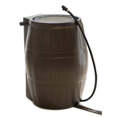 a large brown barrel with a hose attached to it