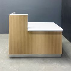 Introducing the Dallas ADA Reception Desk - 55 inches, a perfect blend of accessibility and style. Crafted with a combination of Plywood and MDF, this desk is designed for durability and elegance. The desk counter features a maple tambour finish, while the workspace is covered in a sleek white matte laminate. The toe-kick, made of brushed aluminum solid, adds a touch of modern sophistication. Built to commercial-grade standards, this reception desk ensures long-lasting quality. Designed and hand Drop Front Desk Bar, Ada Reception Desk, Custom Conference Table, Custom Reception Desk, Office Reception Area, Lobby Furniture, Modern Reception Desk, Lobby Seating, Counter Desk