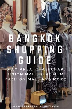 the bangkok shopping guide is displayed in front of clothes and other items on display at an outdoor