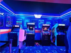 several arcade machines in a brightly lit room