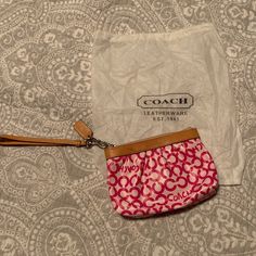 Coach Wristlet With Dust Bag. Nwot, Never Used. Detachable Handle. Light Pink Background With Dark Pink Coach Logos. Tan Leather With Logo Stamped In Front Top Center. Inside Is Hot Pink With Small Pocket. Please Note: There Is A Small Dime-Sized Stain On The Front Left Section Of Leather As Pictured. Approximately 5 Inches Tall And 7 Inches Wide. No Rips Or Tears. Smoke-Free Household. Coach Bags Pink, Pink Coach Wristlet, Daily Use Pink Coach Clutch, Pink Pouch Wristlet With Strap, Coach Pink Wristlet For Travel, Coach Multicolor Pouch Wristlet, Light Pink Background, Coach Logo, Bags Pink