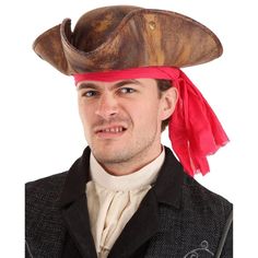 a man wearing a pirate hat with a red bandana on his head and black jacket