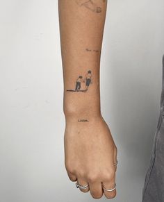 a person with a small tattoo on their arm