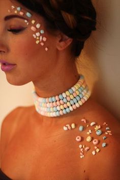 a woman with white and blue beads on her chest