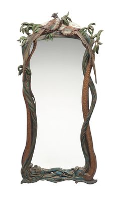 a mirror with vines and birds on it