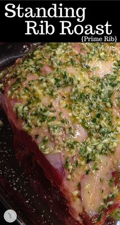 a close up of a piece of meat on a pan with broccoli sprinkled on it