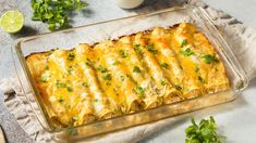 a casserole dish with cheese and cilantro