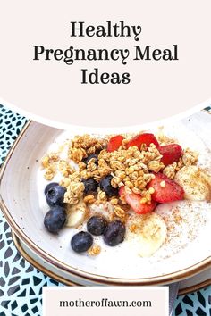 a white plate topped with granola and fruit